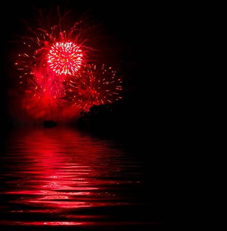 Red fireworks explosion on a black backgroundの写真素材