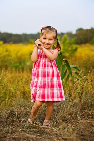 Portrait of a happy liitle girlの写真素材