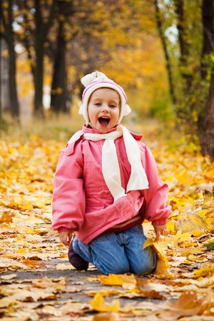 Autumn portrait of cute little caucasian girlの写真素材
