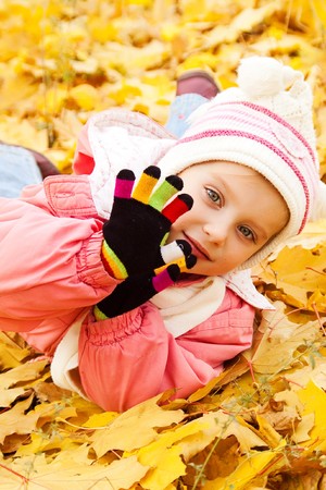 Autumn portrait of cute little caucasian girl の写真素材