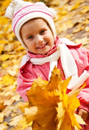 Autumn portrait of cute little caucasian girl の写真素材