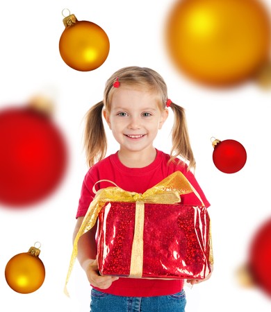 Cute girl with a xmas gift. Isolated on witeの写真素材