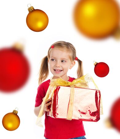 Cute girl with a xmas gift. Isolated on witeの写真素材