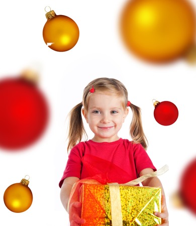 Cute girl with a xmas gift. Isolated on witeの写真素材