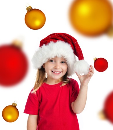 Cute little girl in the santa claus hat. Isolated on witeの写真素材
