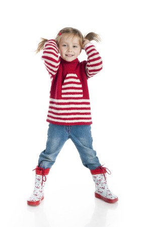 Little girl wearing sweater and gumboots isolated on whiteの写真素材