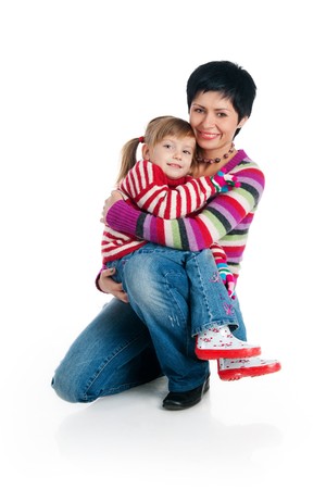 Smiling people. Mother and her daughter. Studio isolatedの写真素材