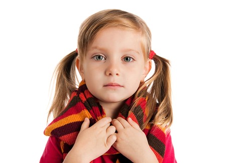 portrait of a cute little girl in a striped scarfの写真素材