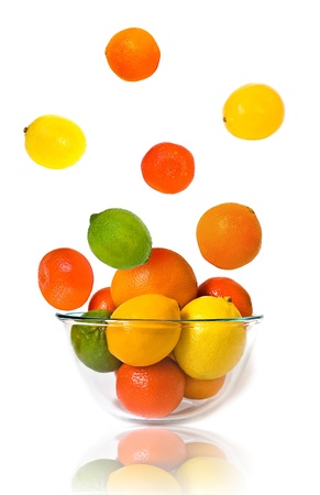 Bowl of citrus fruits on white backgroundの写真素材