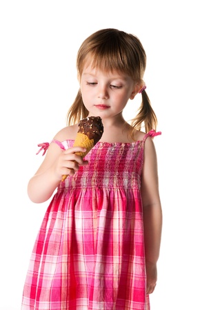 cute little girl with the ice-cream on a white backgroundの写真素材
