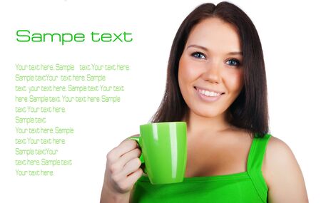 Pretty young women with the cup of tea on whiteの写真素材