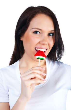 Cute woman with bright candy. Studio shotの写真素材