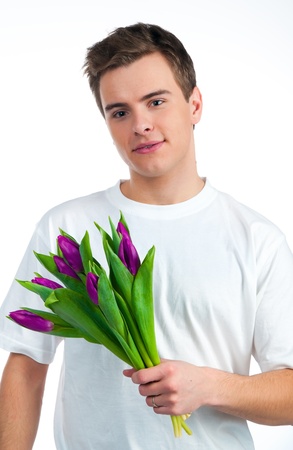 Cute young men give the flowers over white backgroungの写真素材