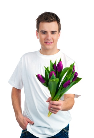 Cute young men give the flowers over white backgroungの写真素材