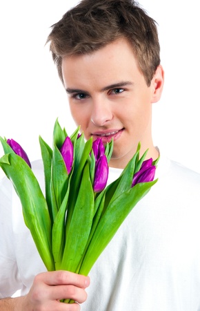 Cute young men give the flowers over white backgroungの写真素材