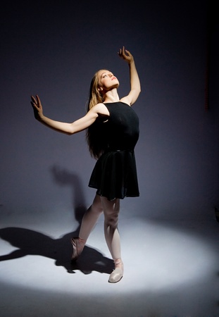 a young wonderful ballerina is dancing gracefullyの写真素材