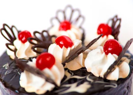 Sweet chocolate cake isolated on white backgroundの写真素材