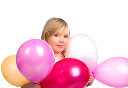 Pretty little girl with balloonsの写真素材