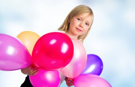 Pretty little girl with balloonsの写真素材