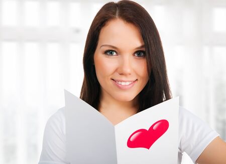 girl with a Valentine's cardの写真素材