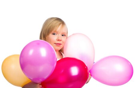 Pretty little girl with balloonsの写真素材