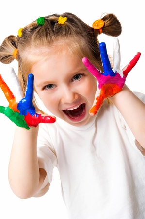 smiling girl with the palms painted by a paint.の写真素材