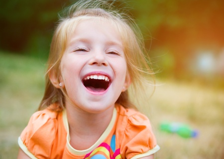 Cute little girl  on the meadowの写真素材