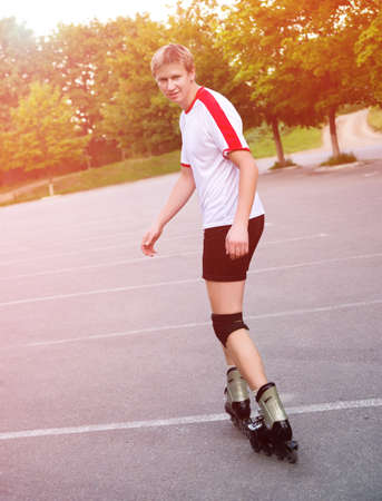 Young active roller blade skaterの写真素材