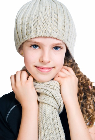 Little girl in cap and scarfの写真素材
