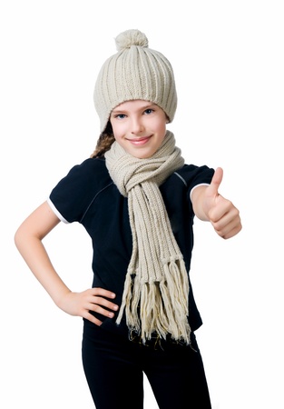 Little girl in cap and scarfの写真素材