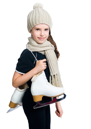 Cute little girl with figure skatesの写真素材