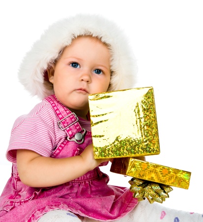 Cute girl with a Christmas giftの写真素材