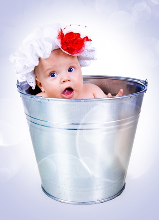 Baby on a bucketの写真素材