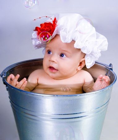 Baby on a bucketの写真素材