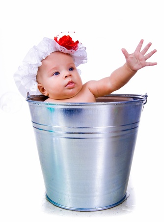 Baby on a bucketの写真素材