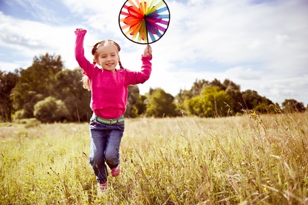 Girl on grass in summer  dayの写真素材