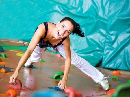 women climbing on a wallの写真素材