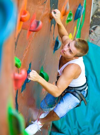 men climbing on a wallの写真素材