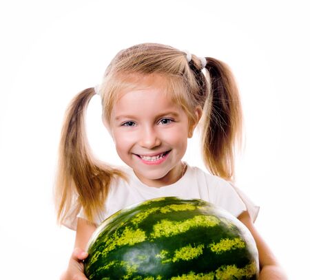 little girl eating big piece of watermelonの写真素材