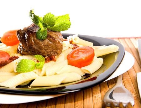 Pasta with a meatの写真素材