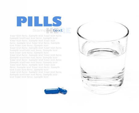 Close up of green pill and water on a white backgroundの写真素材