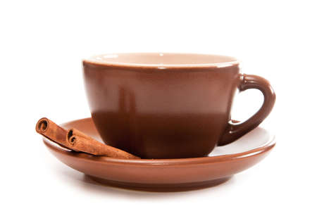 Ceramic cup of coffee with cinnamon on whiteの写真素材