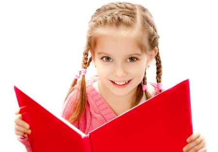 sweet happy little girl reading a bookの写真素材