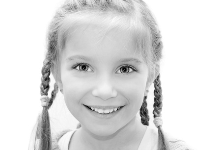 Cute little girl on a white background close-upの写真素材