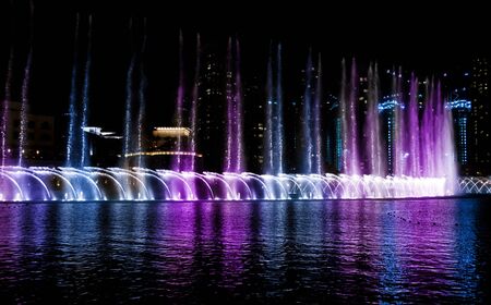 Colored water fountain at night   Dubai UAEの写真素材