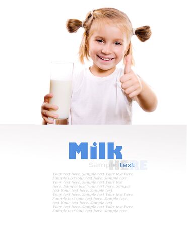 Portrait of a little girl holding a cup of milk, isolated on whiteの写真素材