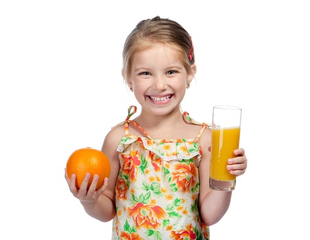 Cute little girl  with the orange juiceの写真素材