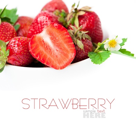 strawberry berry with green leaf and flower isolated on white backgroundの写真素材