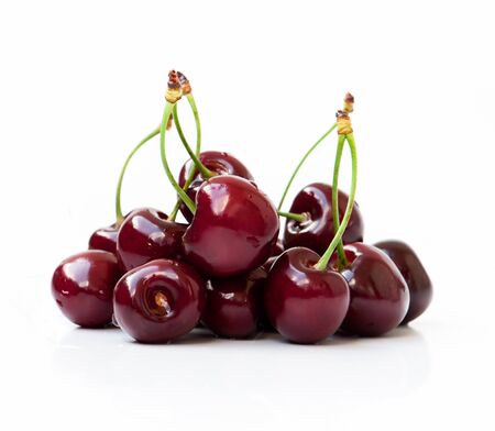 red cherries on a white backgroundの写真素材