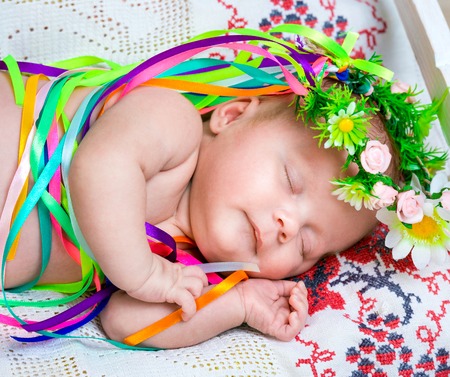 newborn girl sleeping in the Ukrainian national costumeの写真素材